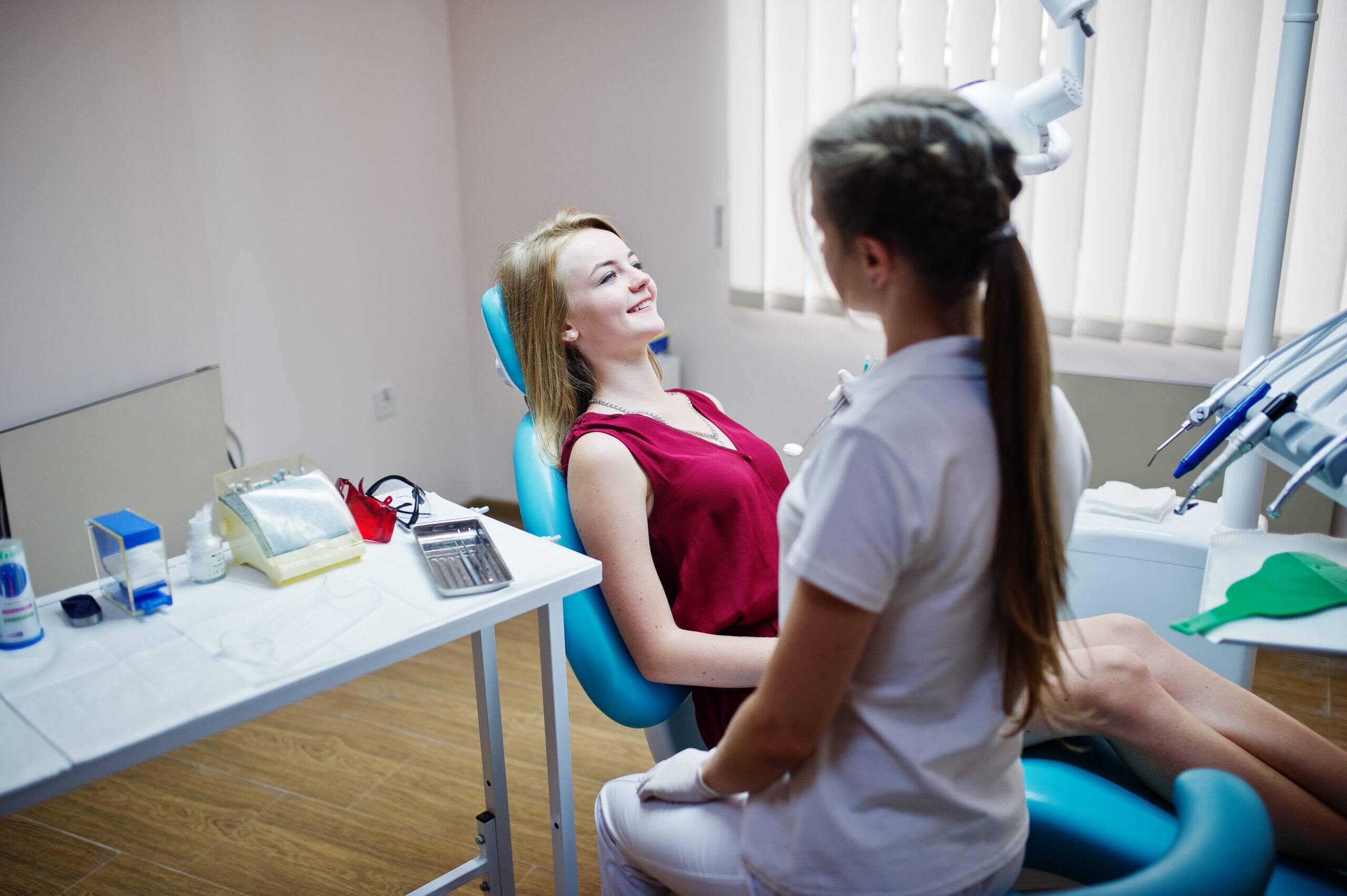 Dentist treating patient in dental chair