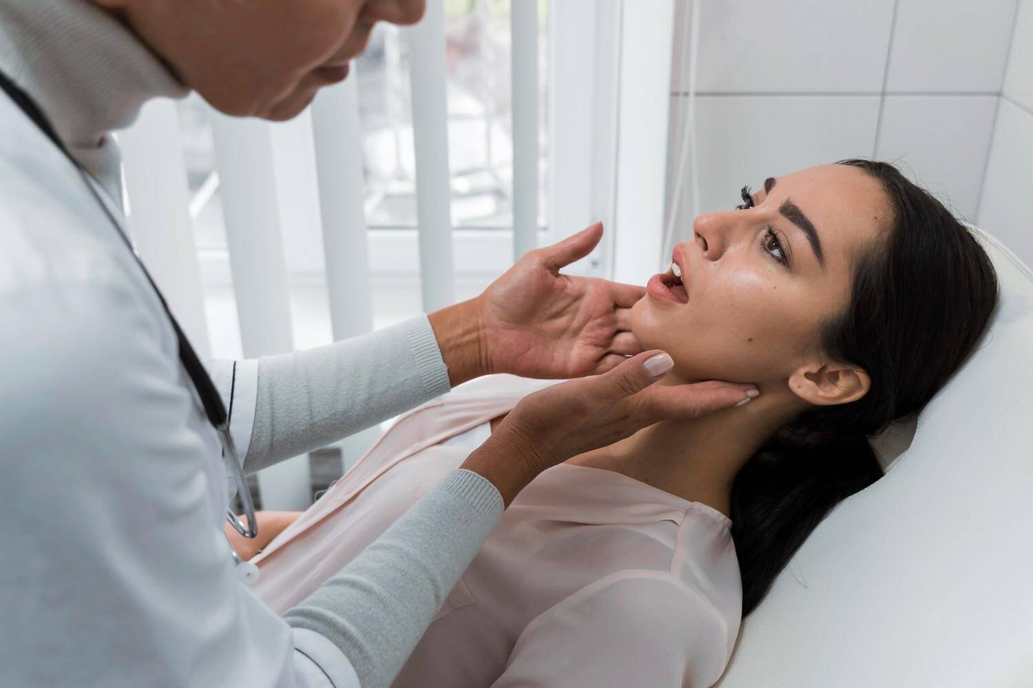 Dentist examining a patient's jaw